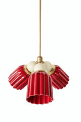 A small chandelier with deep, glossy jasper red fluted ceramic cone shades, paired with cream connector balls and brass hardware. The soft cream balls bring high contrast and a bit of restraint against the saturated red, a confident pairing for a traditional dining room or entry that wants real color without going bold in every single element.