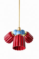 A small chandelier with deep, glossy jasper red fluted ceramic cone shades, paired with soft hydrangea blue connector balls and brass hardware. The cool blue balls bring an unexpected, almost Americana-adjacent contrast against the saturated red, a bold pairing for a dining room or entry that wants real color with a bit of surprise.