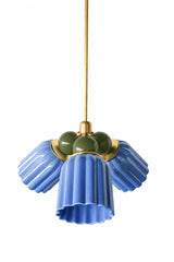 A blue and olive chandelier with a traditional, slightly masculine edge. The Marcella Small Chandelier pairs three fluted, scalloped ceramic shades in glossy sky blue with a cluster of olive green glass globe bulbs and brass hardware, an earthy color combination that feels more Ralph Lauren than pastel. A strong pick for a study, breakfast nook, or any room that wants color with some gravity.