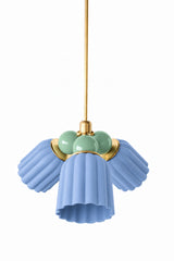 A blue and green chandelier with an easy, garden-fresh feel. The Marcella Small Chandelier pairs three fluted, scalloped ceramic shades in dusty matte blue with a cluster of vista green glass globe bulbs and brass hardware, a soft but unexpected color combination. A good fit for a breakfast nook, bathroom, or bedroom that wants a touch of coastal traditional color.