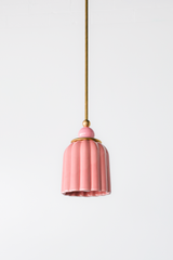 soft pastel Chinoiserie Pink ceramic ceiling pendant with brass hardware and a light pink powdercoated ball. Inspired by art deco glass with updated modern accents. This beautiful pendant light adds color and shape to any space. 