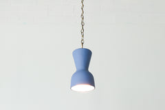 bright blue and brass chained ceramic pendant lighting fixture. Made in the USA hand-cast tinted porcelain pendant kitchen light with real raw brass chain.  Beautiful unglazed porcelain ceramic pendant ceiling light fixture. Matte blue porcelain chinoiserie inspired pendant light fixture.