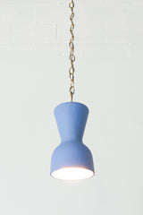 bright blue and brass chained ceramic pendant lighting fixture. Made in the USA hand-cast tinted porcelain pendant kitchen light with real raw brass chain.  Beautiful unglazed porcelain ceramic pendant ceiling light fixture. Matte blue porcelain chinoiserie inspired pendant light fixture.