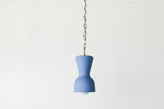 bright blue and brass chained ceramic pendant lighting fixture. Made in the USA hand-cast tinted porcelain pendant kitchen light with real raw brass chain.  Beautiful unglazed porcelain ceramic pendant ceiling light fixture. Matte blue porcelain chinoiserie inspired pendant light fixture.