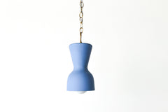 bright blue and brass chained ceramic pendant lighting fixture. Made in the USA hand-cast tinted porcelain pendant kitchen light with real raw brass chain.  Beautiful unglazed porcelain ceramic pendant ceiling light fixture. Matte blue porcelain chinoiserie inspired pendant light fixture.