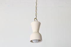 Cream and brass chained ceramic pendant lighting fixture. Made in the USA hand-cast tinted porcelain pendant kitchen light with real raw brass chain.  Beautiful unglazed porcelain ceramic pendant ceiling light fixture. 