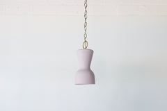 Pastel purple and brass chained ceramic pendant lighting fixture. Made in the USA hand-cast tinted porcelain pendant kitchen light with real raw brass chain.  Beautiful unglazed porcelain ceramic pendant ceiling light fixture. 