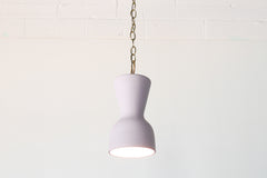 Pastel purple and brass chained ceramic pendant lighting fixture. Made in the USA hand-cast tinted porcelain pendant kitchen light with real raw brass chain.  Beautiful unglazed porcelain ceramic pendant ceiling light fixture. 