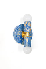 Mediterranean Blue, Cream & Gold Marbled Thalia wall sconces with a glossy, hand-marbled finish and warm brass center detail. Each piece is one-of-a-kind, with painterly swirls that feel coastal, eclectic, and unapologetically fun.