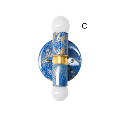 This blue and gold marbled Thalia sconce has a richer, bolder marbled pattern with strong cobalt tones and metallic gold accents. The handmade finish gives each piece a unique look, while the clean silhouette keeps it versatile. It’s a strong option for customers looking for a blue wall sconce with a coastal vibe, but it also works well in maximalist and design-forward interiors.