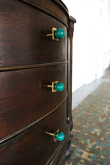 Mermaid green and brass square gumball drawer pulls on a dark wood dresser. Colorful cabinet knobs for kitchen, bathroom, kids room, or nursery. Midcentury modern furniture hardware with a bold, jewel-tone finish. Handmade powder-coated knobs add a pop of color and whimsy to any space.