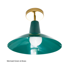 This version of the Bruxelles Flushmount pairs the same mermaid green shade with warm brass hardware instead of chrome, giving it a softer, more traditional feel. It still solves the same problem: real color and a design-forward shape for ceilings too low for a pendant, whether that's a kitchen, entryway, hallway, or laundry room.
