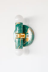 Saturated color and brass accents make the Thalia an easy statement piece for bathrooms, powder rooms, hallways, and bedrooms. It can be installed vertically or horizontally, and works as either a wall sconce or a flush mount ceiling light.