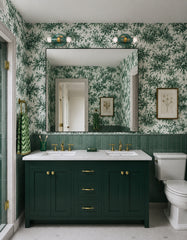 Mermaid Green, cream, and gold hand-marbled Small Thalia Sconces used as bathroom vanity lighting above a large mirror in a green double vanity bathroom. The room features dark green cabinetry, brass faucets, green wall tile, and green toile wallpaper, making the petite two-light sconces a natural fit for grandmillennial bathrooms, chinoiserie decor, colorful powder rooms, and muted maximalist interiors.