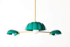 Midcentury modern style chandelier with three powder-coated shell-shaped shades. shell shade details.