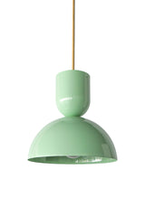 Soft mint is the color that makes a kitchen feel fresh and a little playful, and this Taeuber pendant brings it in a clean, sculptural shape. The two-part silhouette stacks a rounded cup over a wide domed bell, all finished in a glossy mint powder coat with a warm brass stem, shown here lit against white brick. It reads breezy and cheerful, the kind of statement lighting that turns an island, breakfast nook, or sink into a soft focal point. Hang one for a gentle pop of color or a row for rhythm. A lovely ch