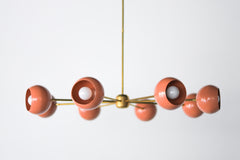 Peach and Brass mid century modern large chandelier with peach colored shades.  Adds a ton of light and style with a pop of Pantone's 2024 color of the year, peach fuzz.