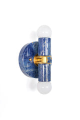 A hand-marbled Thalia wall sconce with a glossy blue, cream, and gold finish and brass center detail. Each piece is one-of-a-kind, with swirling ocean-like movement that feels coastal, eclectic, and design-forward.