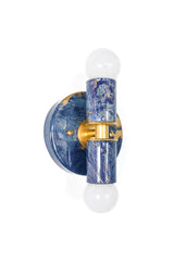 The Thalia sconce shown in a blue marbled colorway with metallic gold veining and warm brass components. A bold accent fixture that works beautifully in coastal-inspired spaces, modern eclectic interiors, and maximalist rooms.