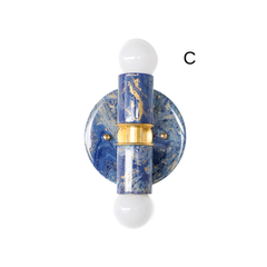 This blue and gold marbled Thalia sconce has a rich, moody finish with dramatic blue swirls and metallic gold veining. The handmade marbling gives the sconce a unique, collected look that feels both playful and elevated. It’s a strong option for customers searching for a blue bathroom sconce, a colorful wall light, or a design-forward fixture with a slightly coastal vibe.