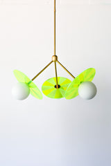 Playful light fixture for nursery in neon green and brass
