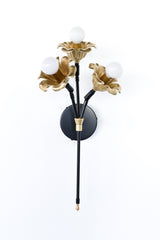 black and brass floral wall sconce.  Each socket includes a large brass flower.  Romantic and unique wall mounted wall sconce with three sockets.  Black and brass finish adds modernity