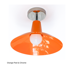 This version of the Bruxelles Flushmount pairs the same bright Orange Peel shade with cool chrome hardware instead of brass, giving it a slightly crisper, more modern feel. It solves the same low-ceiling problem with a design-forward shape, whether that's over a kitchen island, in an entryway, or lighting a hallway or laundry room.