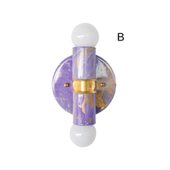 This version of the lavender marbled Thalia sconce has a slightly moodier, more dramatic marbling pattern, with soft lavender, creamy white, and warm brass working together in a way that feels polished but still playful. It has a maximalist spirit, but the pastel palette keeps it light and pretty.