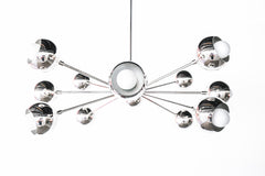 Modern silver sputnik chandelier with multiple spherical bulbs on a minimalistic white background, showcasing a sleek and contemporary design.