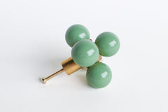 Pastel Vista Green and brass oversized ball cube drawer pull shown on a white background; designed with five lacquered blue spheres arranged in a cube formation on a polished brass base, perfect for high-end interior hardware styling.