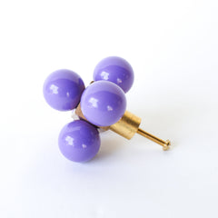 An Orchid Purple Oversized Ball Cube Knob by Sazerac Stitches, featuring four purple spheres mounted in a brass cube, designed as a decorative and modern drawer pull.