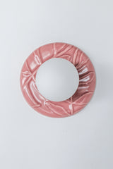 Front product shot of pastel pink glossy ceramic Leafy Sconce with raised botanical leaf pattern and frosted globe shade, pink chinoiserie wall sconce for grandmillennial style interiors, powder rooms, and vintage inspired spaces.