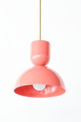 All peach & brass bold geometric pendant light with a dome shade. glossy finish. Great kitchen pendant light. Good for small spaces or small dining tables. Bold, mid-century modern style pendant light that is great for maximalists or eclectic style decor. 