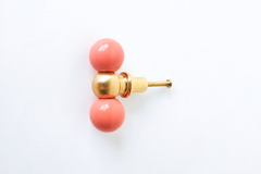 Peach and brass double gumball drawer pull, shown at an angle. A colorful, sculptural knob that works equally well on a dresser makeover, a bathroom vanity, kitchen cabinetry, a kid's room dresser, or an office built-in.
