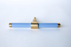 Pastel baby Blue& Brass modern drawer pull.  Add color to cabinets with brass accents with the Piety drawer pulls by sazerac stitches.  Available in over 30 colors with the option to customize. Center mount installation drawer pull with color and brass accents.  Sophisticated colorful bathroom, dresser, vanity, or desk drawer pull.  