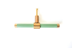 Pastel Green and brass modern drawer pull.  Add color to cabinets with brass accents with the Piety drawer pulls by sazerac stitches.  Available in over 30 colors with the option to customize. Center mount installation drawer pull with color and brass accents.  Sophisticated colorful bathroom, dresser, vanity, or desk drawer pull.  