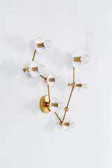 Pisces constellation wall sconce in glossy white with warm brass hardware, featuring powder coated steel disc backplates and a branching star map design with multiple globe bulbs, a celestial zodiac light fixture that works as a bathroom vanity sconce, pretty powder room statement lighting, bedroom wall light, or hallway accent, combining mid century modern brass styling with astrology inspired decor for design lovers who want an artful, sculptural fixture that feels elevated, feminine, and a little bit mag