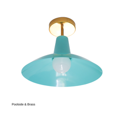 This version of the Bruxelles Flushmount pairs the same soft Poolside aqua shade with warm brass hardware instead of chrome, giving it a gentler, more traditional feel. It solves the same low-ceiling problem with a design-forward shape, whether that's in a bathroom, over a kitchen island, or lighting an entryway or nursery.
