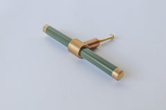 Olive green and brass modern drawer pull.  Add color to cabinets with brass accents with the Piety drawer pulls by sazerac stitches.  Available in over 30 colors with the option to customize.