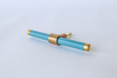 Teal Blue and brass modern drawer pull.  Add color to cabinets with brass accents with the Piety drawer pulls by sazerac stitches.  Available in over 30 colors with the option to customize. Center mount installation drawer pull with color and brass accents.  Sophisticated colorful bathroom, dresser, vanity, or desk drawer pull.  