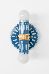 Handpainted blue and white patterned wall sconce inspired by Greece & Portugal.  Maximalist style wall sconce that has a natural element because each one is hand-painted.  The painted thalia is a perfect small sconce that doubles as a statement light fixture because of the bold design.  Great for bathrooms, hallways, and more.  