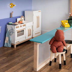 This colorful kids’ play kitchen features the Small Thalia Sconce in yellow by Sazerac Stitches, paired with purple-blue walls and playful details. Perfect inspiration for colorful playrooms, creative kids’ spaces, and nursery design. See more colorful kids’ interiors in our blog: 10 Reasons Kids Need Color in Their Interiors.