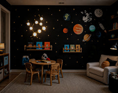 Moody space-themed kids room with the Poolside and Brass Gemini One sconce glowing against black starry wallpaper with planets, an astronaut, and rocket art. The lit white globe bulbs make the fixture look even more like a real Gemini constellation, while the aqua Poolside discs and brass frame add color and warmth. This playful statement wall light works beautifully in a kids room, playroom, nursery, reading corner, or celestial bedroom for families who want colorful, modern zodiac lighting with a little m
