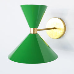 Bright grass green and brass mid century modern style cone-shaped wall sconce.  Designed and made in New Orleans.  Bright green modern wall sconce that can be used in bedrooms, bathrooms, and more.  Fun and colorful lighting. Large Green wall sconce.