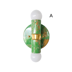 This hand-marbled Thalia sconce pairs spring green, soft cream, and warm gold for a fresh, lively look that instantly brightens a room. Its compact size makes it ideal for bathrooms, small nooks, and other tight spaces where you want a bold detail without overwhelming the room. Because each one is individually marbled by hand, every fixture has its own one-of-a-kind pattern and character. Perfect for eclectic decor, colorful homes, fun powder rooms, and interiors that lean into playful, artful design.