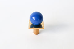 Glossy Mediterranean blue Square Gumball Knob with raw brass base, handcrafted by Sazerac Stitches. Modern hardware for colorful furniture, bathroom vanities, and kitchen cabinets. Bold pop of color in a midcentury modern style, made in New Orleans with 30 powder-coated color options.