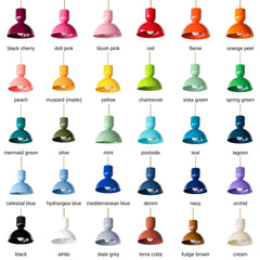 The full Taeuber pendant lineup, 30 powder-coat colors from black cherry and flame to teal, orchid, and cream. Each one pairs a sculptural cup-over-dome shade with a warm brass stem, a soft mid-century silhouette that brings a hit of color and glow to a kitchen island, breakfast nook, bar, or entry. Whether you match your cabinetry or go bold against it, there's a shade for every colorful, collected home. Save this one for when you're choosing your color.