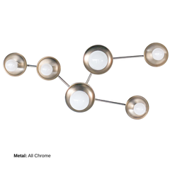 Sculptural Taurus constellation sconce in chrome with layered disc stars and bright globe bulbs, reading like modern wall art. Sleek, reflective metal adds a contemporary, minimalist vibe. Made to order by Sazerac Stitches, New Orleans. Use as hallway lighting, staircase statement lighting, or above a console in an entryway.