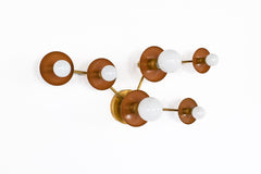 Taurus constellation wall sconce in Fudge with warm brass arms and white globe bulbs, handmade in New Orleans by Sazerac Stitches. A sculptural celestial wall light for earthy interiors, moody bedrooms, hallways, entryways, and modern eclectic homes.