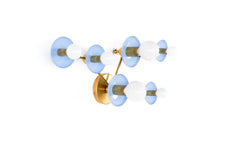 Taurus constellation wall sconce in Celestial Blue with warm brass arms and white globe bulbs, handmade in New Orleans by Sazerac Stitches. A sculptural celestial wall light for pastel interiors, dreamy bedrooms, nurseries, hallways, or a pretty powder room.